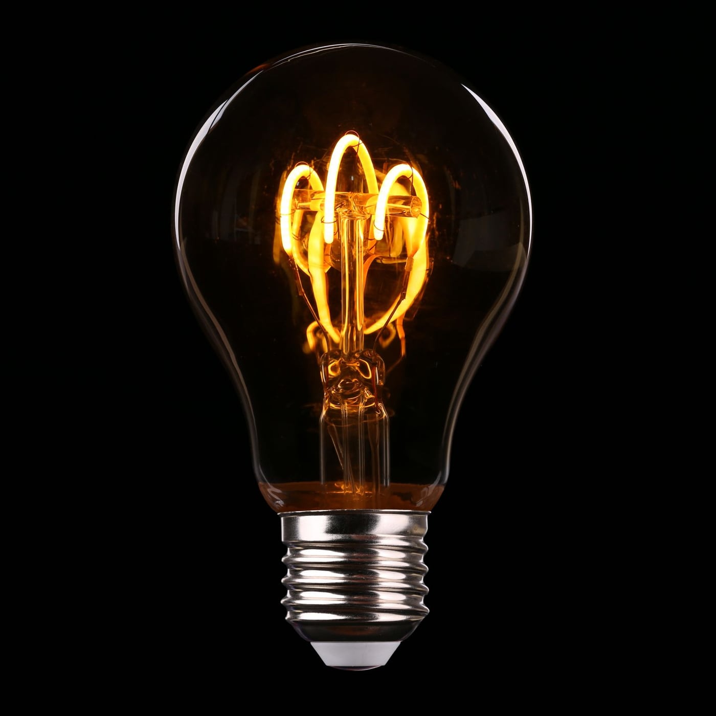 Close-up of a glowing vacuum tube in a high-end studio preamplifier