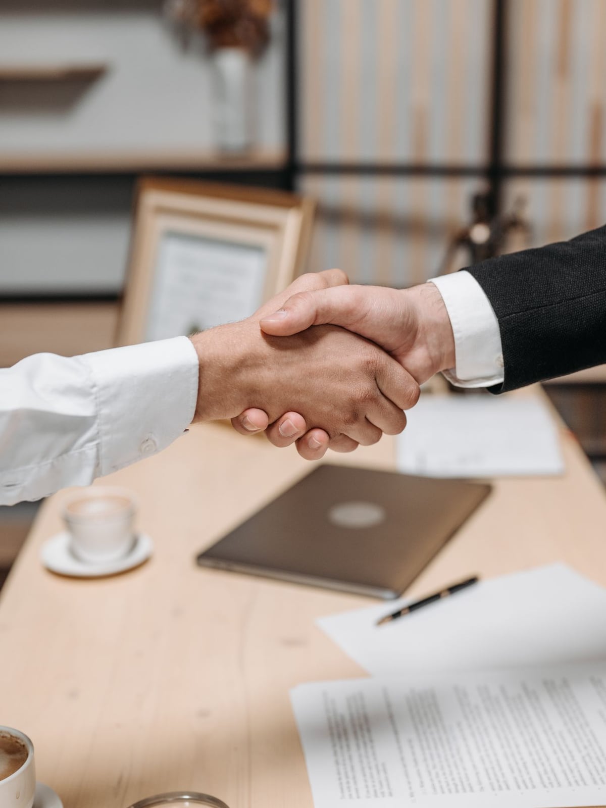 Two business partners agreeing on master rights in a professional atmosphere