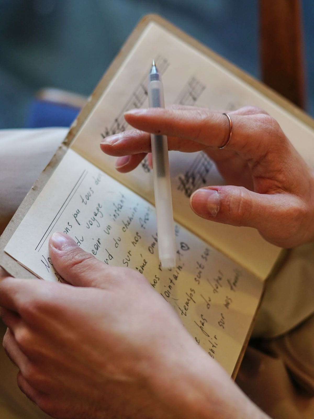 Preparation for recording: song lyrics and water on a wooden table